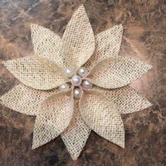 a flower made out of burlock and pearls