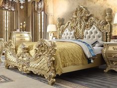 a bedroom with gold furniture and mirrors on the wall