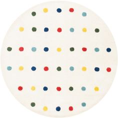 a white rug with multicolored dots on it