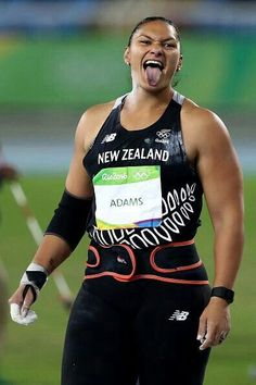 a female athlete with her mouth open and tongue out