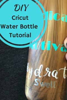 someone is holding a bottle with the words diy cricut water bottle