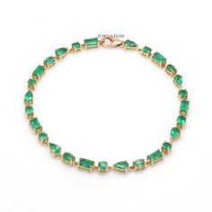 Real emerald tennis bracelet in solid gold | Emerald cut emerald tennis bracelet gold | Natural mix shape emerald link chain bracelet gold STONE DETAILS : ✦ Gemstone : Emerald ✦ Gemstone Type : Natural ✦ Gemstone Size : 5x3 mm ✦ Gemstone Shape : Emerald cut, Round, Pear, Oval ✦ Number of gemstones : 21 ✦ Gemstone Weight : 3-4 carats ✦ Gemstone Grade : AAA METAL DETAILS : ✦ Metal : 14K/18K Gold ✦ Metal Color : Yellow / White / Rose Gold ✦ Setting : Prong Setting ✦ Bracelet Box : Yes SHIPPING DETA Emerald Tennis Bracelet, Tennis Bracelet Gold, Rainbow Sapphires, Bracelet Box, Link Chain Bracelet, Rainbow Bracelet, Gold Stone, Gold Bracelet Chain, Emerald Gemstone