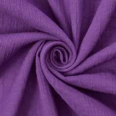 a close up view of the fabric on a purple shirting material that is very soft