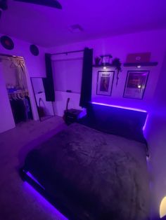 a bed with purple lights in a room