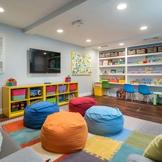 a child's playroom with colorful bean bag chairs