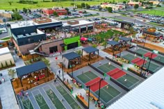 an aerial view of a tennis court with people playing