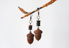 Handmade earrings  with natural acorns that were picked right after they fall off of the oak tree. Every acorn was allowed to dry, cleaned and gently attached to the cap with bronze hooks. I also added some coconut beads to give it a special touch. These forest earrings will always keep a piece of my touch. They will gently adorn your ears and hold warm wishes inside. Traditionally, acorns are considered as a symbol of good luck and abundance, so these handmade  acorn earrings can be worn as a t Peter Pan Jewelry, Rp Outfits, Forest Earrings, Acorn Jewelry, Acorn Earrings, Botanical Earrings, Beads Earrings, Fall Earrings, Fall Ideas