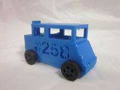 a blue plastic toy bus on a white background