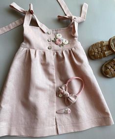 PRODUCT DESCRIPTION This charming linen baby dress is lovingly handcrafted by skilled embroiderers in a traditional Vietnamese village. We pour our heart into each piece, and we hope your little one will adore it as much as we do! Perfect for summer days, this dress is soft, lightweight, and designed for comfort and movement. It's an ideal choice for first birthdays, special occasions, or simply for everyday sweetness. PLEASE NOTE: Colors may appear slightly different depending on your device sc First Birthday Girl Dress, Linen Baby Dress, Dress With Roses, 1st Birthday Dress, Roses Embroidery, Kids Linen, 1st Birthday Dresses, Linen Outfit, First Birthday Girl