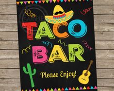 a sign that says taco bar please enjoy with an image of a guitar and sombrero