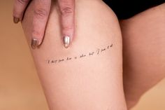 a woman's leg with writing on it