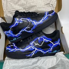 For those looking to stand out, the Blue Lightning Black Custom Air Force 1 offers a unique spin on the classic style. Featuring distinct blue lightning detailing across the upper, this iteration features a smooth black matte finish that is sure to turn heads.  iends, family, that special someone, or yourself ✨ - Exactly as shown in the pictures. - Brand New & Authentic. 💯  - Hand Painted with attention to detail. 👨‍🎨  - Waterproof and Flexible. ❤️  - Unisex model. Please refer to the Size Chart. - Free Worldwide Shipping. ✈︎ Lightning Shoes, Blue Lightning, Nike Brand, Cute Nikes, Steam Punk