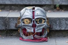 This is Corvo Attano's mask from Dishonored game series by Bethesda studios. This steampunk mask of the main character from Dishonored and Dishonored 2 games, which is corvo attano. This mask is good solution for cosplay events, cosplay parties, and as Halloween accessoir. Inluded: -mask Also in our shop are availiable: Corvo Attano costume: https://www.etsy.com/listing/536333110/ Emily costume: https://www.etsy.com/listing/536334676/ We accept payment plans. ✈️Delivery 🐢Free shipping: 2-4 week Steampunk Costume Accessories For Carnival, Steampunk Costume Accessories For Fantasy Events, Gothic Full Face Masks For Cosplay, Steampunk Mask For Cosplay Events, Steampunk Masquerade Mask For Cosplay Events, Steampunk Mask Costume Accessories, Steampunk Costume Accessories For Masquerade And Cosplay, Steampunk Mask For Cosplay, Steampunk Masquerade Mask For Cosplay And Fantasy Events