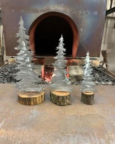 some trees are sitting in front of an oven