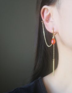 Gold chain dangle bar Carnelian teardrop gemstone ear cuff hoop clip on earrings, metal is gold plated over brass. Details :- **Gold dangle bar size is 30mm length x 1.5mm width. **Ear cuff width is 12mm(outer). **Carnelian teardrop gemstone size is approx 14mm x 8mm. **Hoop clip on size is 11mm(inner diameter) and 13mm(outer diameter). **Earrings length is approx 90mm. **Earring weight is approx 2.6g/pc ♥ ♥ Hoop clip on - are comfortable to wear and will not drop off easily, and they look like pierced ear earrings. ♥ ♥ These earrings come in a beautiful gift box. ♥ ♥ Pls convo us if you have any queries. ♥ ♥Thank you so much for visiting and hope you enjoy shopping with us. Ear Earrings, Beautiful Gift Boxes, Earings Piercings, Gold Chains, Ear Piercings, Clip On Earrings, Ear Cuff, Etsy Earrings, Dangle Drop Earrings