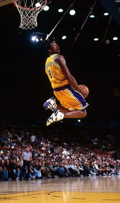 a basketball player jumping up into the air