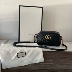 I Purchased This Bag A Couple Years Ago And I Only Used It On Special Occasions Because I Was So Scared Of It Getting Damaged So It’s Barely Used. Comes With Dust Bag And Gift Box. I Purchased This At The Gucci Store In South Coast Plaza, 100% Authentic. The Small Gg Marmont Chain Shoulder Bag Has A Softly Structured Shape And A Zip Top Closure With The Double G Hardware. The Chain Shoulder Strap Has A Leather Shoulder Detail. The Camera Bag Is Made In Matelass Leather With A Chevron Design And Gg On The Back. Black Matelass Chevron Leather With Gg On The Back Antique Gold-Toned Hardware Double G Interior Open Pocket Adjustable Chain Shoulder Strap With 60cm Drop. Can Also Be Worn A Gucci Store, Gucci Marmont, Chevron Design, Gg Marmont, Small Shoulder Bag, Chain Shoulder Bag, Zip Top, Michael Kors Jet Set, Gucci Bag