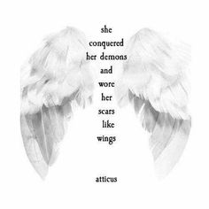 two white wings with the words, she conquer her demons and wore her scars like wings