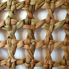 a close up view of a woven piece of material that is made from natural materials