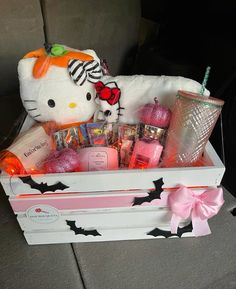 a hello kitty gift box filled with lots of goodies for her birthday or baby's first birthday