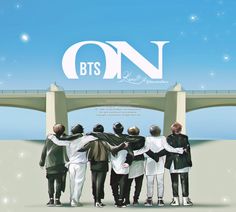 a group of people standing in front of a bridge with the words bts on it