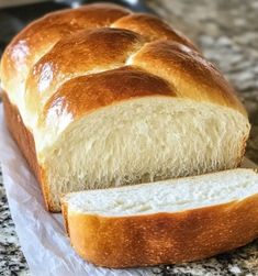 a loaf of white bread sitting on top of a counter