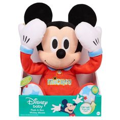 a mickey mouse stuffed animal in a box