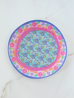 a colorful plate sitting on top of a white counter