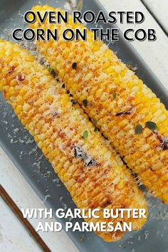 an image of corn on the cob with garlic butter and parmesan cheese