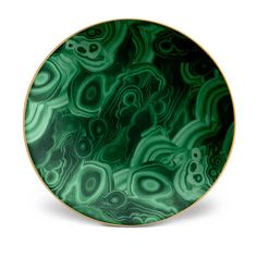 a green marble plate with gold trim