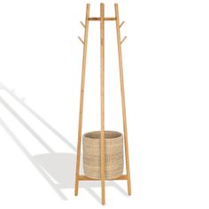 a wooden coat stand with a basket on the bottom and two hooks attached to it