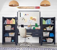 a desk with a red chair in front of it and bookshelves on the wall