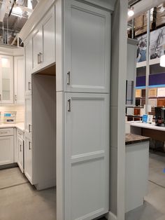 a white refrigerator freezer sitting inside of a kitchen