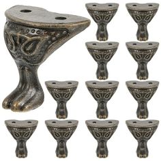 a set of twelve metal candlesticks with ornate designs