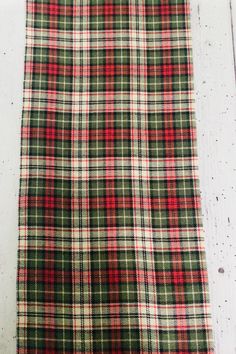 a red and green plaid fabric on a white background