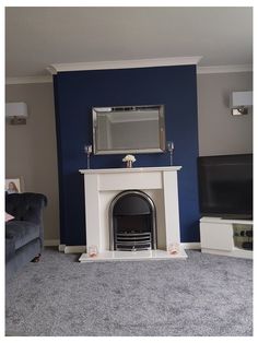 a living room with blue walls and a fireplace