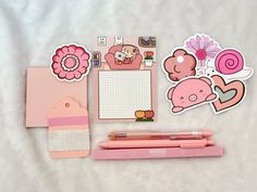 pink stationery with stickers, notepad and pen