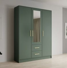 a green armoire with mirrored doors in a room