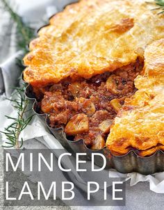 a close up of a pie in a pan with the words ground lamb pie on it