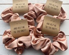 four scrunffles with words on them that say and help me, tie the knot?