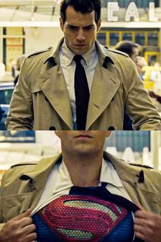 a man in a trench coat and tie is holding a superman t - shirt on his chest