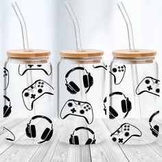 three glass jars with game controllers drawn on them