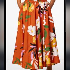 You'll Turn Heads In This Silky Skirt With Burnt Orange Background And Bold Floral Print. * Long Skirt * Elastic Waist * 100% Polyester * Machine Wash * Imported Floral Print Long Skirt For Beach, Vacation Floral Print Full Skirt Bottoms, Floral Print Full Skirt Bottoms For Vacation, Floral Print Full Skirt For Vacation, Floral Print Full Skirt Bottoms For Day Out, Floral Print Skirted Bottoms For Beach, Beach Skirted Bottoms With Floral Print, Orange Flared Skirt For Spring, Casual Floral Print Maxi Skirt For Vacation