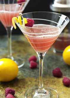 two glasses filled with raspberry lemon drop martinis