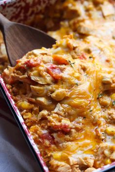 a casserole dish with meat and vegetables in it, ready to be eaten