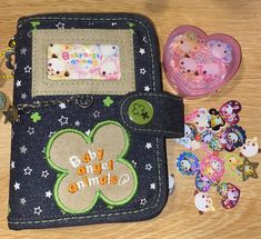 there is a wallet with buttons and magnets on it