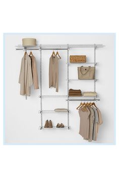 an organized closet with clothes, shoes and handbags hanging on the wall next to it