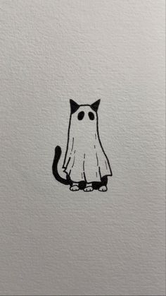 a black and white drawing of a cat sitting on top of a piece of paper