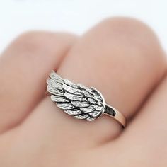 925 Sterling Silver Angel Wing Ring Metal:925 Sterling Silver Height:7 mm >Nickel Free >Tarnish Resistant >No Allergic reaction >30 days return policy ++Items come in a gift box ready to be gifted Please contact me if you have any questions about the jewelry you are interested in buying. My Shop: https://www.etsy.com/shop/banujewelryusa Follow BANU Jewelry on Facebook, Instagram and other social media sites to keep up to date with newest products. www.instagram.com/shopbanujewelry ww Angel Rings, Elegant Sterling Silver Winged Rings, Gold Sterling Silver Jewelry With Angel Wings, Silver Angel Wings Jewelry Gift, Sterling Silver Angel Wing Ring, Wing Angel, Wing Ring, Angel Wing Ring, Angel Ring