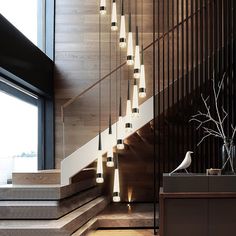 an image of stairs in the middle of a room with wood flooring and walls